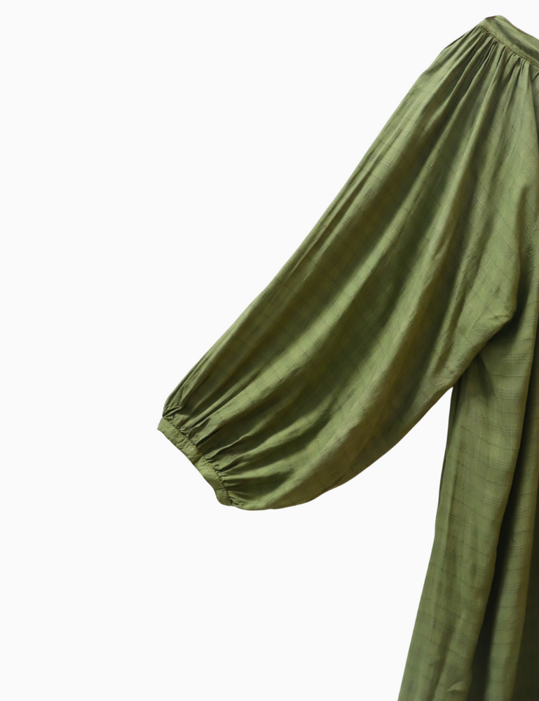 
                  
                    close up product photo of flores organic sugarcane dress in forest green on white background
                  
                