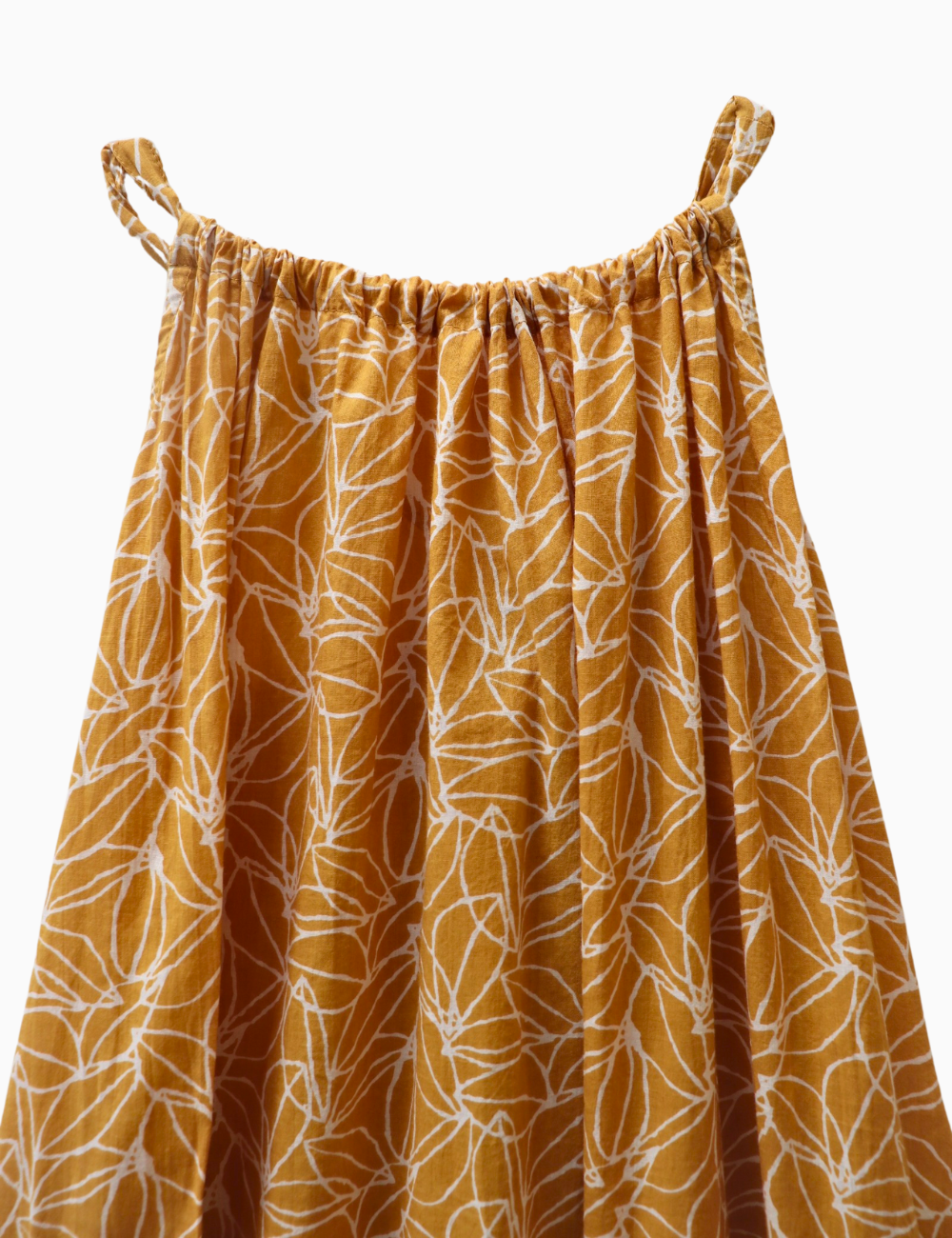 
                  
                    close up product photo of light patterned gomera maxi dress in mustard seed print
                  
                