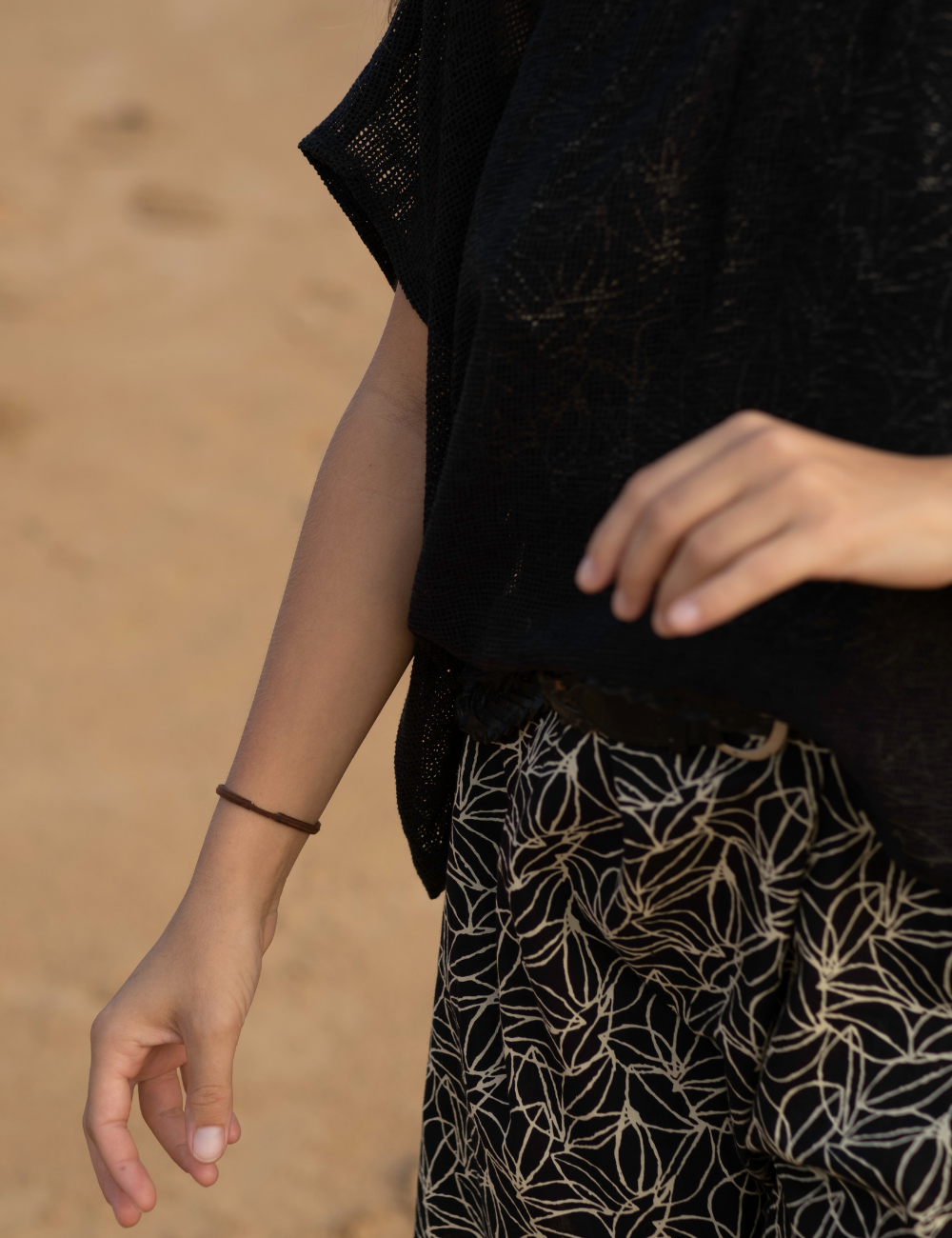 
                  
                    Dark patterned mini dress with oversized net charcoal top in desert
                  
                