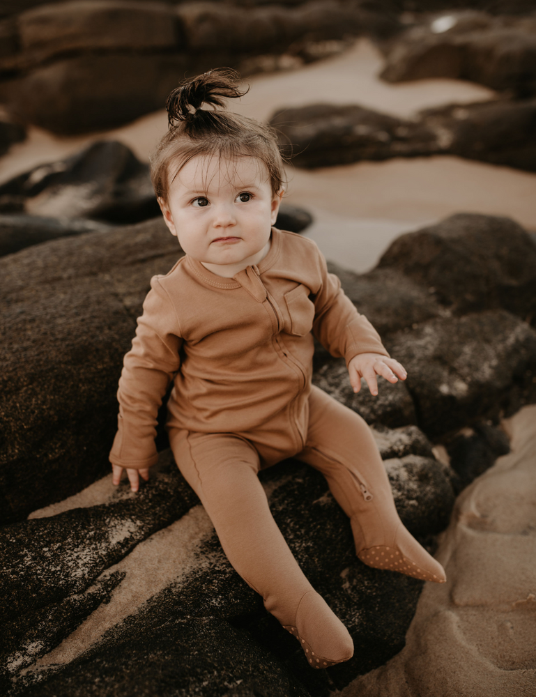 
                  
                    organic footed jumpsuit with double zip fawn natural baby toddler sustainable clothing byron bay brand Zaya and Kai
                  
                