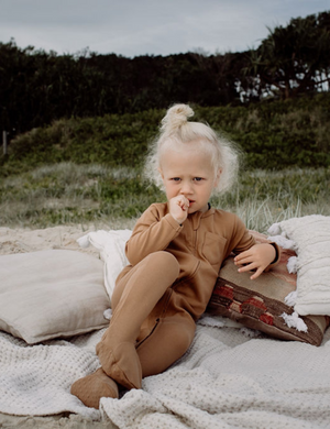 
                  
                    organic footed jumpsuit with double zip fawn natural baby toddler sustainable clothing byron bay brand Zaya and Kai
                  
                