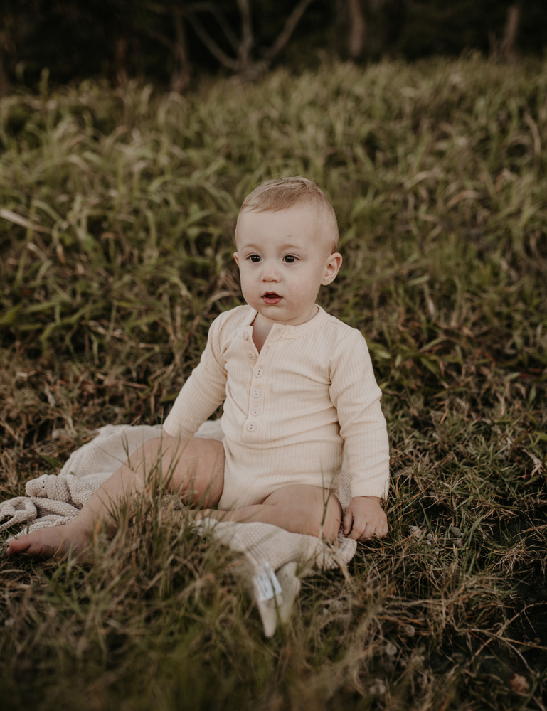 
                  
                    organic long sleeved romper ribbed cream natural baby toddler sustainable clothing byron bay brand Zaya and Kai
                  
                