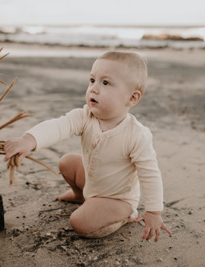 
                  
                    organic long sleeved romper ribbed cream natural baby toddler sustainable clothing byron bay brand Zaya and Kai
                  
                
