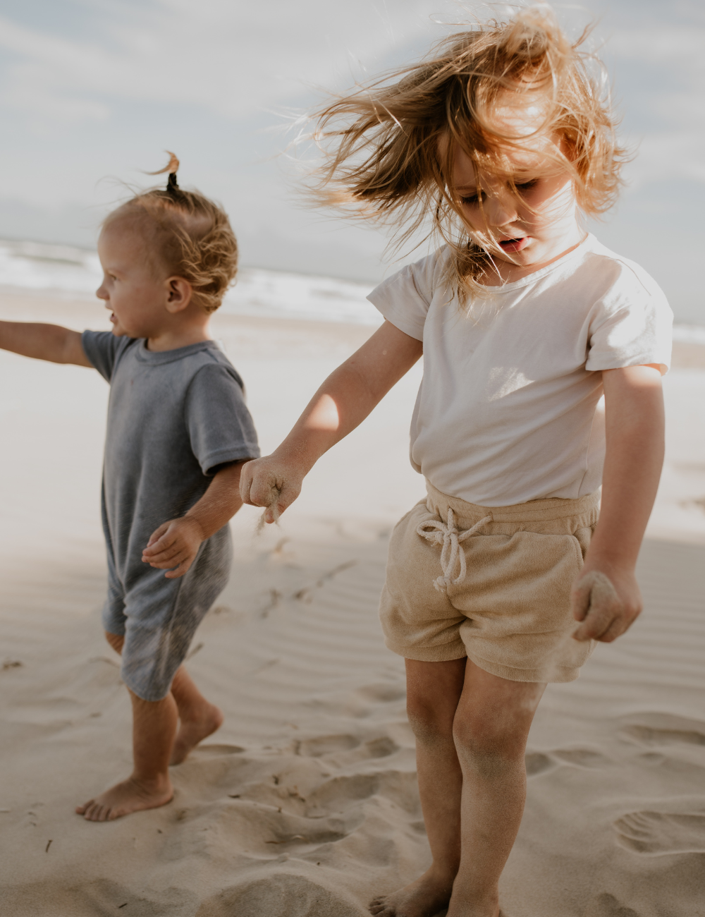 
                  
                    terry towel shorts sand oversized jumpsuit sky blue natural baby toddler sustainable clothing byron bay brand Zaya and Kai
                  
                