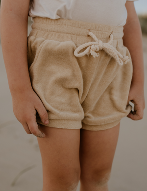 
                  
                    terry towel shorts sand natural baby toddler sustainable clothing byron bay brand Zaya and Kai
                  
                